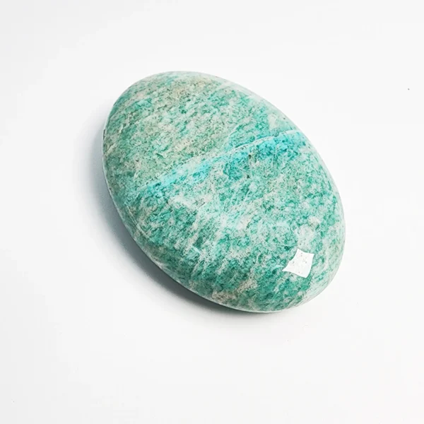 Let truth flow gently from heart to voice as you hold the Amazonite Palm Stone. Calm, balancing, and quietly transformative, it supports authentic expression while guiding inner growth.