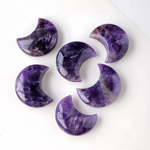 The Amethyst Crescent Moon Stone combines amethyst's healing properties with the crescent moon shape, symbolizing feminine energy, intuition, and inner wisdom. It clears negative energy, balances emotions, and purifies the mind, body, and spirit. Ideal for meditation, it helps achieve deep relaxation and mental clarity, while restoring emotional balance and harmony. Its compact size allows for easy carrying, helping to reset your mindset and reduce stress anytime, anywhere. To use, keep it in your bag or pocket and touch it when needed, or hold it in your palm during meditation to focus on its healing vibrations.