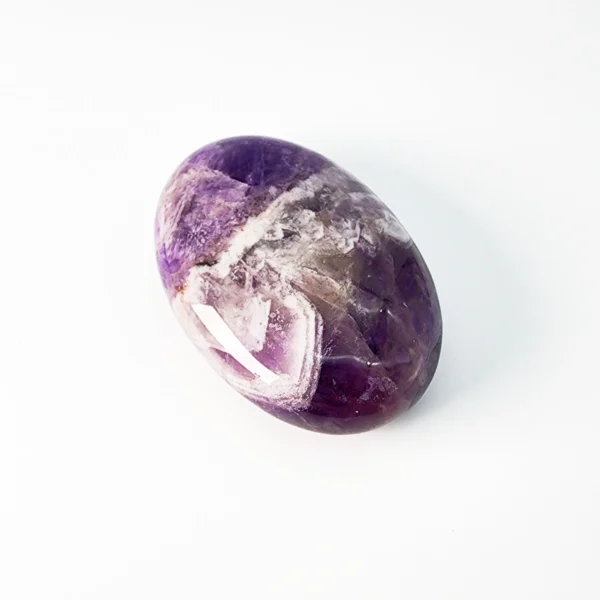 Let calm awareness and intuitive clarity surround you as you hold the Amethyst Palm Stone. Serene, protective, and deeply centering, it supports emotional balance while guiding spiritual insight.