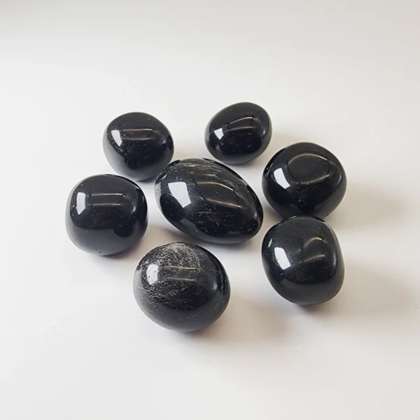 Anchor yourself in protection and truth with the Black Obsidian Tumbled Stone. Deeply grounding and powerfully cleansing, it shields your energy while supporting profound personal transformation.