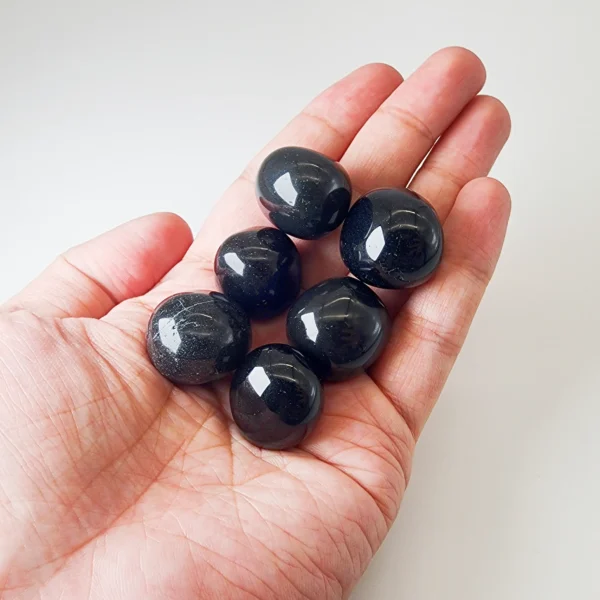 Anchor yourself in protection and truth with the Black Obsidian Tumbled Stone. Deeply grounding and powerfully cleansing, it shields your energy while supporting profound personal transformation.