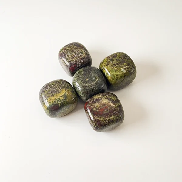 Reconnect with strength and renewal through the Bloodstone Tumbled Stone. Deeply grounding and quietly empowering, it supports vitality, courage, and meaningful transformation.