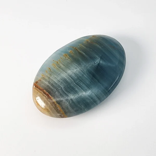 Let steady confidence and emotional calm settle within you as you hold the Blue Onyx Palm Stone. Cool, grounding, and quietly empowering, it strengthens resolve while restoring inner balance.
