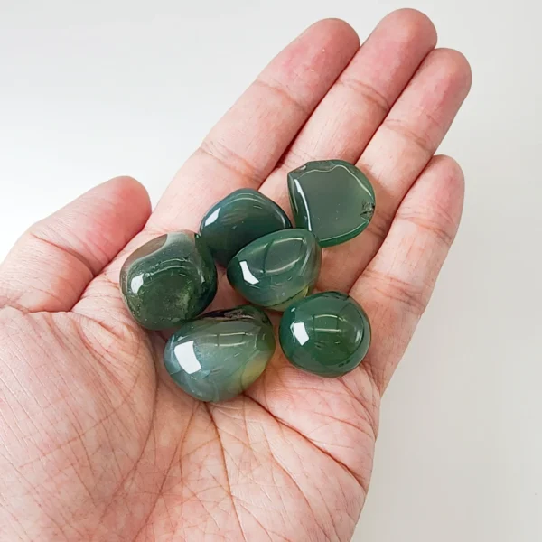 Restore calm and gentle vitality with the Green Agate Tumbled Stone. Smooth and reassuring, it soothes restless energy while supporting physical balance and emotional ease. Ideal for moments of tension, overthinking, or disrupted rest.