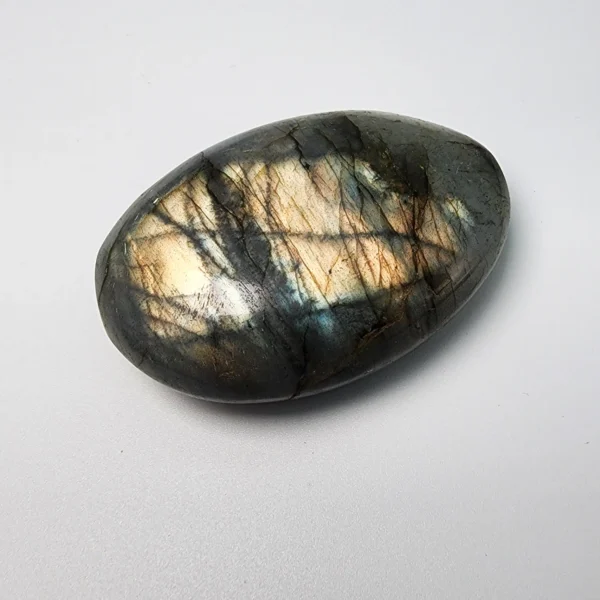 Let transformation unfold gently as you hold the Labradorite Palm Stone. Shimmering with quiet mystery, it supports change while protecting your inner light and intuition.