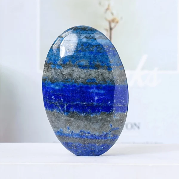 Let truth rise and confidence settle into your voice as you hold the Lapis Lazuli Palm Stone. Deep blue and quietly empowering, it supports clear communication while strengthening inner resolve.