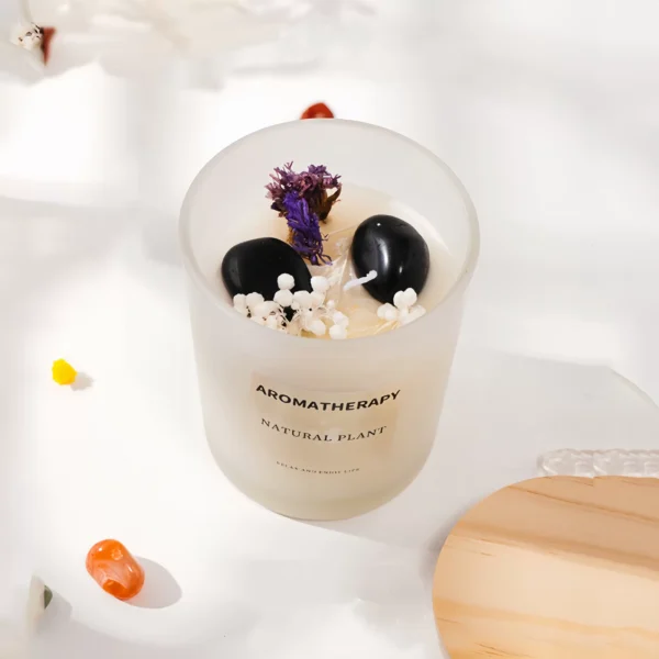 This multifunctional candle integrates obsidian, natural plant essential oils, and dried flowers. Obsidian absorbs and transforms negative energy, clearing and protecting spaces while enhancing energy fields. Effective for meditation, work environments, and home settings, its essential oils and dried flowers further enhance purification. The calming aroma promotes relaxation, creating a cozy atmosphere. This candle provides deep relaxation, clears negative emotions, and restores balance. Obsidian enhances self-protection, prevents negative interference, and improves concentration. To use, light it on a stable surface and enjoy during meditation, yoga, or in any space needing purification. Always use safely and avoid leaving it unattended.