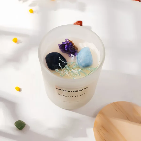 This aromatherapy candle combines the protective energy of obsidian with the calming properties of aquamarine, natural plant essential oils, and dried flowers to offer powerful protection, emotional healing, and balance. Obsidian shields against negative influences, clears fear and anxiety, and enhances inner strength. Aquamarine alleviates stress and promotes clarity and emotional stability. The combination creates a balanced and tranquil environment, ideal for meditation, yoga, or space purification. Its soft fragrance purifies the air and provides relaxation. To use, light the candle on a stable surface, enjoy the warm glow, and ensure it's used safely without being left unattended.