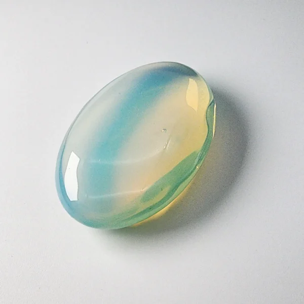 Let inspiration soften into calm as you hold the Opal Palm Stone. Gentle, luminous, and emotionally soothing, it nurtures creativity while restoring inner peace.