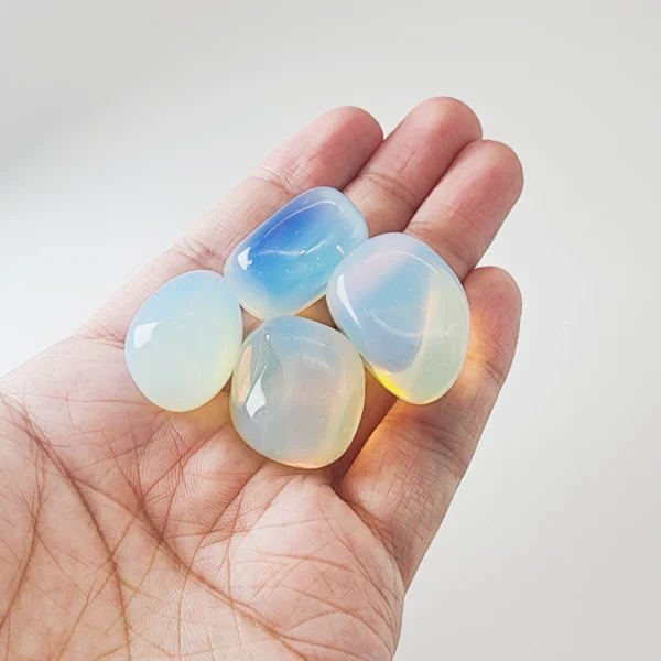 Invite inspiration and emotional flow with the Opal Tumbled Stone. Luminous and expressive, it awakens creativity, nurtures intuition, and supports abundance through emotional clarity.