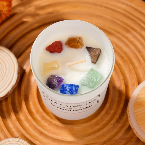 This aromatherapy candle combines natural plant essential oils with seven selected crystals for energy cleansing, charging, and emotional balance. It includes Red Jasper for confidence and motivation, Clear Quartz for energy purification and mental focus, Amethyst for stress relief and relaxation, Lapis Lazuli for intuition and communication, Green Aventurine for emotional balance, Tiger's Eye for decision-making and stability, and Citrine for abundance and positivity. The candle releases a long-lasting fragrance, purifies the air, and creates a warm, relaxing atmosphere, enhancing meditation, yoga, and daily routines by encouraging the free flow of energy. To use, light the candle on a stable surface, enjoy during meditation or relaxation, and use as a space purifier. Always use safely and avoid leaving it unattended.