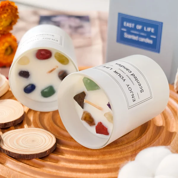 This aromatherapy candle combines natural plant essential oils with seven selected crystals for energy cleansing, charging, and emotional balance. It includes Red Jasper for confidence and motivation, Clear Quartz for energy purification and mental focus, Amethyst for stress relief and relaxation, Lapis Lazuli for intuition and communication, Green Aventurine for emotional balance, Tiger's Eye for decision-making and stability, and Citrine for abundance and positivity. The candle releases a long-lasting fragrance, purifies the air, and creates a warm, relaxing atmosphere, enhancing meditation, yoga, and daily routines by encouraging the free flow of energy. To use, light the candle on a stable surface, enjoy during meditation or relaxation, and use as a space purifier. Always use safely and avoid leaving it unattended.