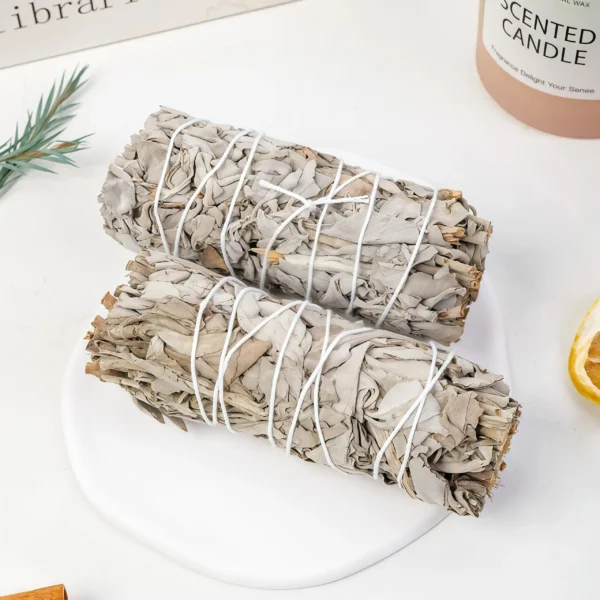 White Sage has been used for centuries in purification rituals and spiritual practices. Its aroma helps clear negative energy and raise vibrational frequencies. Lighting a White Sage Stick for meditation allows the smoke to clear the mind and create a focused state. For crystal cleansing, it removes negative energies from the surface of crystals, restoring their pure energy field. To use, light the stick, wave it around the item or space needing purification, and inhale its aroma during meditation. For crystals, place them in the smoke and gently wave the stick over them.