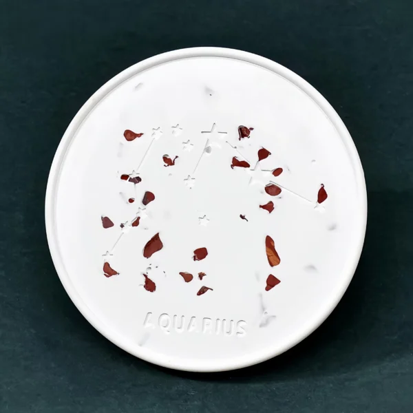 The Aquarius Zodiac Crystal Plaster Plate enhances creativity, independent thinking, and problem-solving abilities. Red Jasper, Aquarius' matching crystal, boosts courage, decisive thinking, and self-confidence, empowering Aquarius to face challenges. Made from natural gypsum, the plate serves as a cleanser and charger for crystals, clearing negative energy and amplifying positive vibrations. Ideal for placement in a workspace, creative area, or meditation space, it supports clarity of thought and creative motivation.