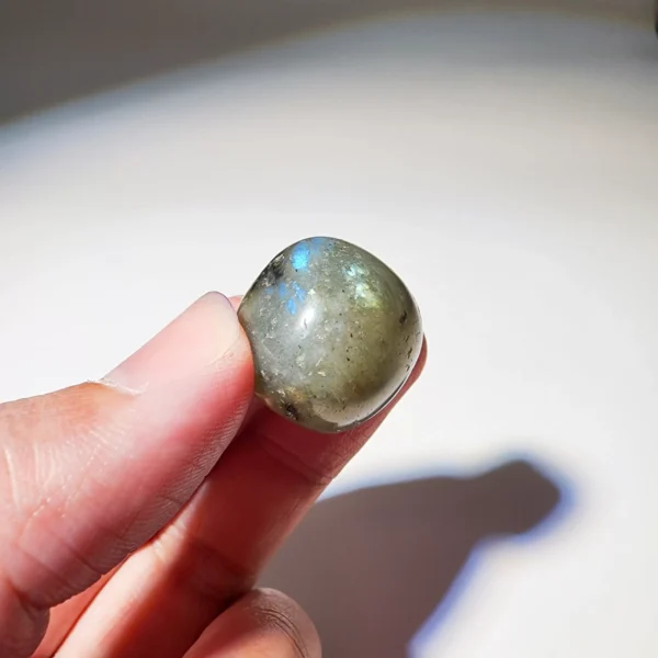 Step into transformation with the Labradorite Tumbled Stone. Mysterious and illuminating, it supports change, awakens intuition, and strengthens courage during moments of deep transition.