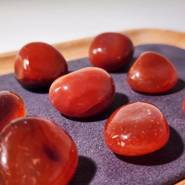 Restore calm strength and physical balance with the Red Agate Tumbled Stone. Warm, steady, and deeply soothing, it supports vitality while easing tension within the body and mind.