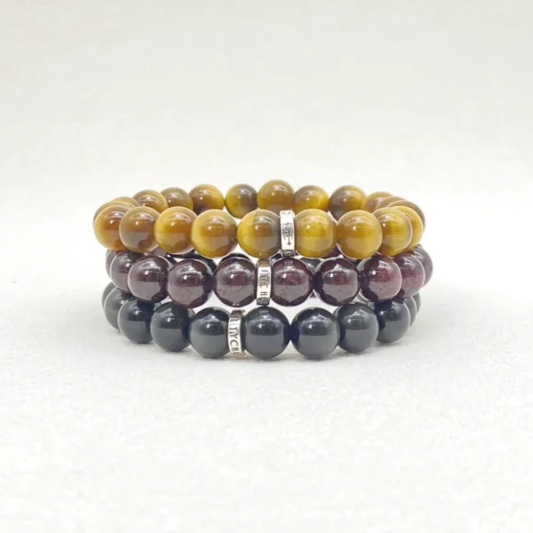 Capricorn is disciplined, reliable, and determined, yet sometimes struggles with self-doubt. This Capricorn Zodiac Jewelry set features Tiger’s Eye, Garnet, and Silver Sheen Obsidian, chosen to provide grounding, protection, and emotional balance. Perfect for daily wear or meditation, the bracelets support resilience and steady progress.