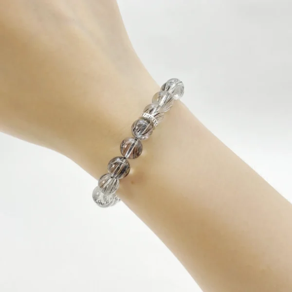 Empower yourself with the Black Rutilated Quartz Bracelet, a grounding and protective crystal bracelet that strengthens your energy and focus. Designed to align with the Root Chakra, it helps you break through limits, boost courage, and maintain vitality in daily life.
