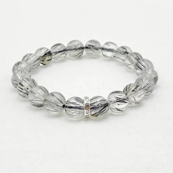 Empower yourself with the Black Rutilated Quartz Bracelet, a grounding and protective crystal bracelet that strengthens your energy and focus. Designed to align with the Root Chakra, it helps you break through limits, boost courage, and maintain vitality in daily life.