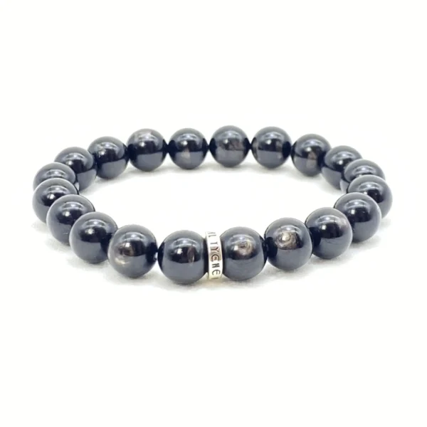 The Hypersthene Bracelet promotes grounding, clarity, and spiritual protection. Known for its deep silvery-black sheen, this crystal anchors your energy, helping you stay calm and decisive. It dissolves illusion and confusion while connecting you to the stabilizing rhythm of the earth.