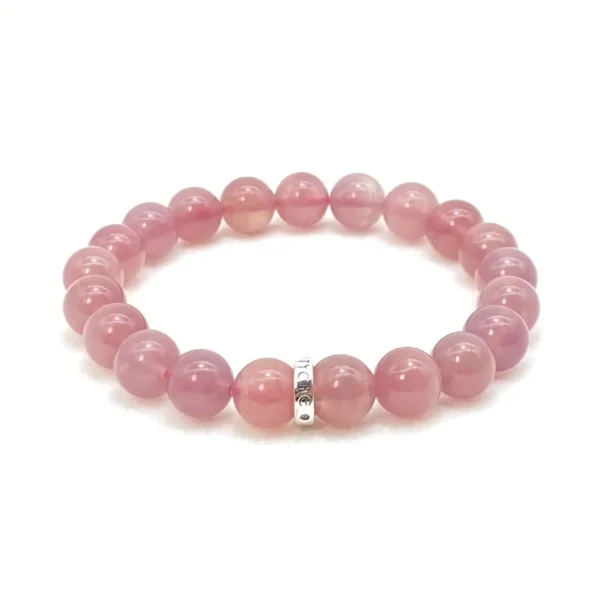 The Rose Quartz Bracelet, crafted from rare pinkish-purple rose quartz from Madagascar, radiates love, calm, and emotional healing. Made with Authentic AAA Grade gemstones, it balances the Heart and Sacral Chakras, helping you forgive, reconcile, and rediscover peace. Perfect for self-healing and rebuilding confidence in relationships.