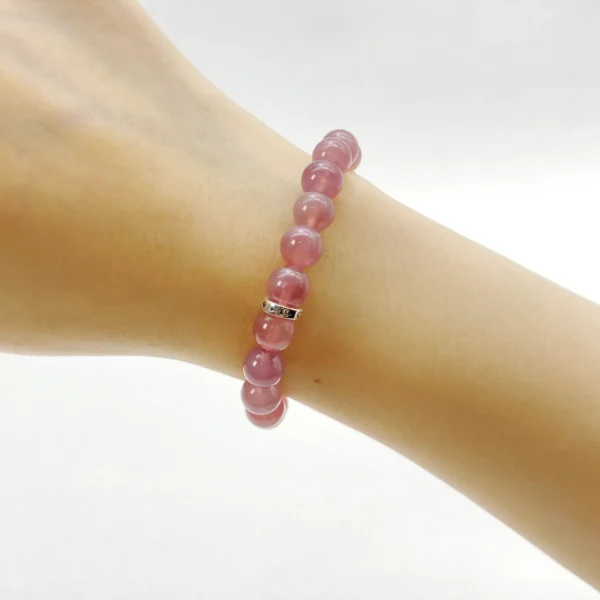 The Rose Quartz Bracelet, crafted from rare pinkish-purple rose quartz from Madagascar, radiates love, calm, and emotional healing. Made with Authentic AAA Grade gemstones, it balances the Heart and Sacral Chakras, helping you forgive, reconcile, and rediscover peace. Perfect for self-healing and rebuilding confidence in relationships.