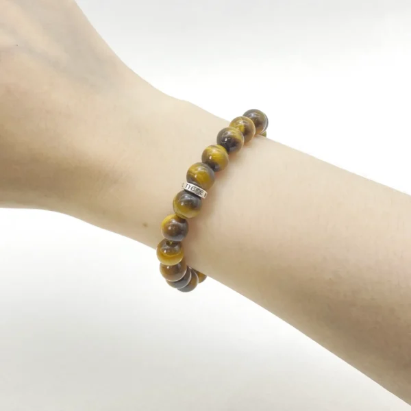 The Tiger Eye Bracelet, made from Authentic AAA Grade gemstones, radiates courage, motivation, and strength. Its golden-brown shimmer activates the Solar Plexus Chakra, empowering confidence and decisiveness in any situation. Perfect for new beginnings, leadership, and overcoming negativity, this bracelet channels bold energy and determination.