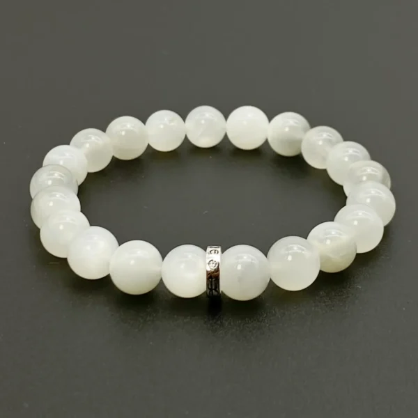 The White Moonstone Bracelet glows with the energy of healing and recovery. Crafted from Authentic AAA Grade gemstones, this luminous piece calms emotions, enhances intuition, and promotes spiritual balance. Connecting the Crown and Third Eye Chakras, it supports emotional renewal and stability in love and life. Ideal for those seeking inner peace and spiritual clarity.