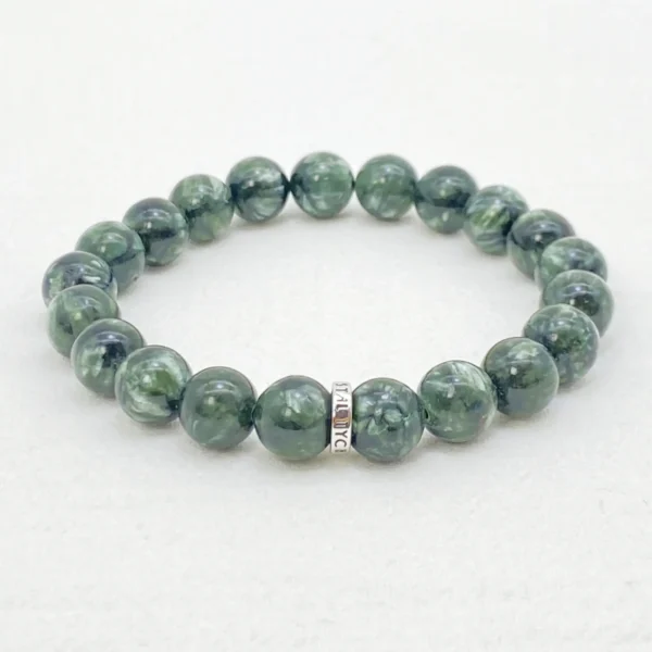 The seraphinite crystals bracelet is crafted from authentic Seraphinite, revered as the Angel Stone for its wing-like patterns symbolizing protection and spiritual upliftment. Ideal for seekers of belonging, emotional healing, and higher guidance, it supports Crown and Heart Chakra alignment. This rare stone deepens intuition and inner peace.