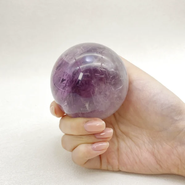 The Amethyst Sphere radiates calm, wisdom, and spiritual clarity. Gently soothing the mind while enhancing intuition, it supports emotional balance and inner peace. Resting securely on its round base, it brings harmony to any space.