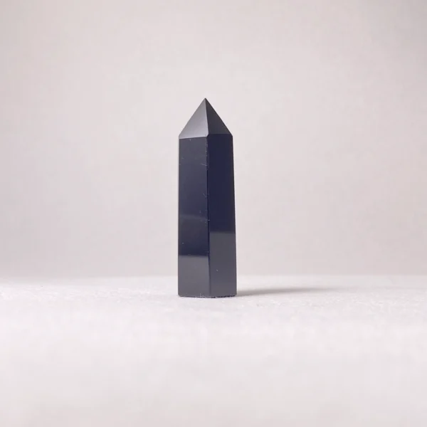 The Black Obsidian Mini Point is a powerful grounding crystal that shields against negativity while supporting deep inner transformation. Its sharp, focused form helps cut through energetic blockages, offering clarity, protection, and strength during times of profound change and emotional intensity.