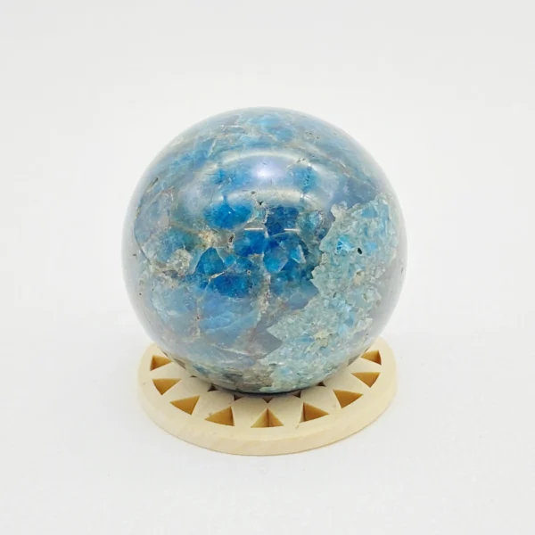 The Blue Apatite Sphere encourages honest expression, clarity, and confident communication. Its calming yet activating energy helps you find your voice and speak with authenticity. Resting securely on its round base, it brings openness and emotional ease into any space.