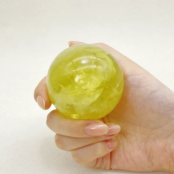 The Citrine Sphere radiates warmth, optimism, and vibrant abundance. Known for its uplifting energy, it supports prosperity, ambition, and joyful motivation. Resting on its round base, it fills your space with confidence and forward-moving momentum.