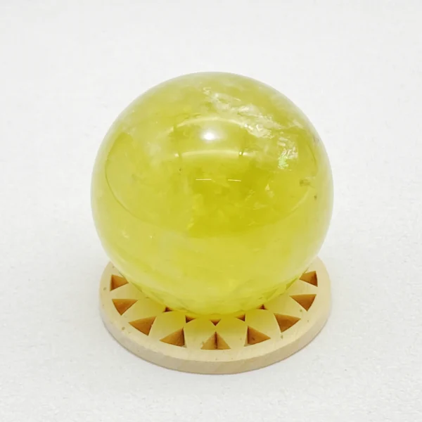The Citrine Sphere radiates warmth, optimism, and vibrant abundance. Known for its uplifting energy, it supports prosperity, ambition, and joyful motivation. Resting on its round base, it fills your space with confidence and forward-moving momentum.
