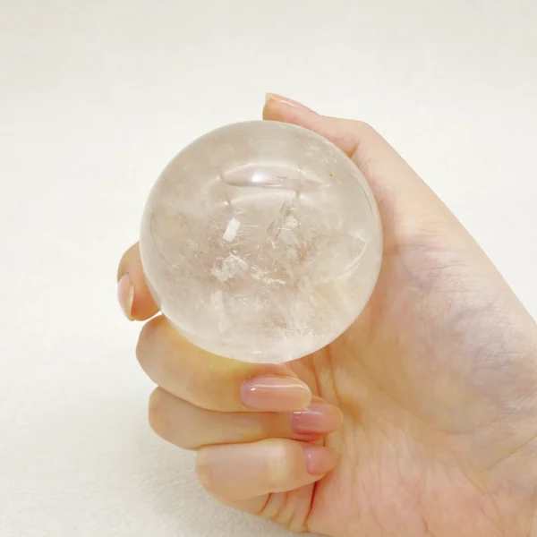 The Clear Quartz Sphere radiates pure clarity and balanced energy in all directions. Known as a master crystal, it supports spiritual growth while grounding and protecting your energy field. Resting on its round base, it brings harmony, focus, and calm strength to any space.