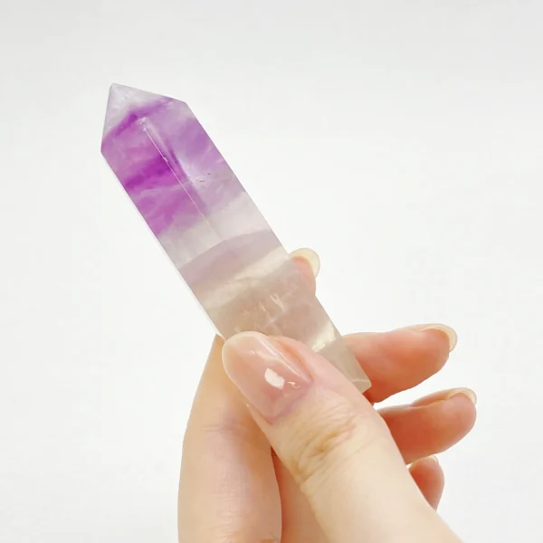 The Fluorite Point is a crystal of clarity, insight, and inspired focus. Revered for its ability to organize thoughts and awaken intuition, it supports creative flow, mental discipline, and spiritual awareness. Its pointed form helps channel refined energy, making it ideal for learning, meditation, and moments requiring both imagination and precision.