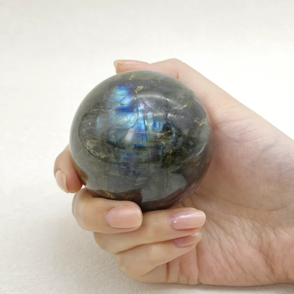 The Labradorite Sphere awakens transformation, inner strength, and intuitive awareness. Its luminous energy supports change while guiding you through uncertainty with clarity and courage. Resting on its round base, it brings depth, mystery, and renewal into any space.