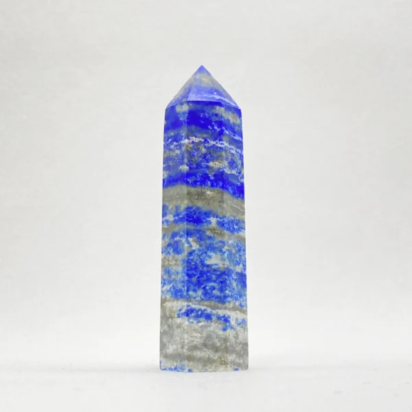 The Lapis Lazuli Point is a crystal of truth, insight, and empowered expression. Long honored as a stone of wisdom and leadership, it supports confident communication, focused thinking, and decisive action. Its pointed form directs energy with clarity, helping you articulate your inner truth, strengthen self-belief, and move forward with purpose.