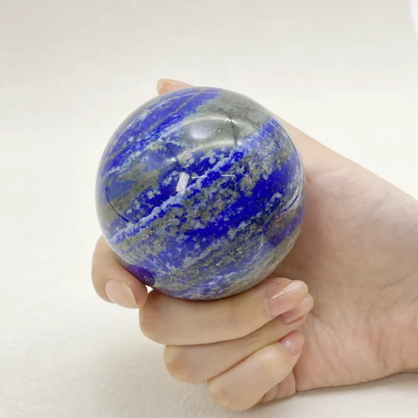 The Lapis Lazuli Sphere awakens inner truth, focused wisdom, and confident self-expression. Its deep blue energy supports clarity of thought while strengthening motivation and insight. Resting on its round base, it brings depth, intelligence, and purposeful calm into any space.