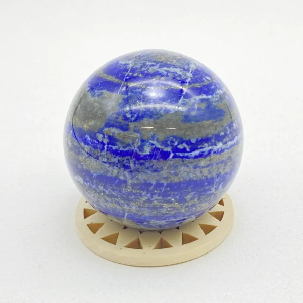 The Lapis Lazuli Sphere awakens inner truth, focused wisdom, and confident self-expression. Its deep blue energy supports clarity of thought while strengthening motivation and insight. Resting on its round base, it brings depth, intelligence, and purposeful calm into any space.