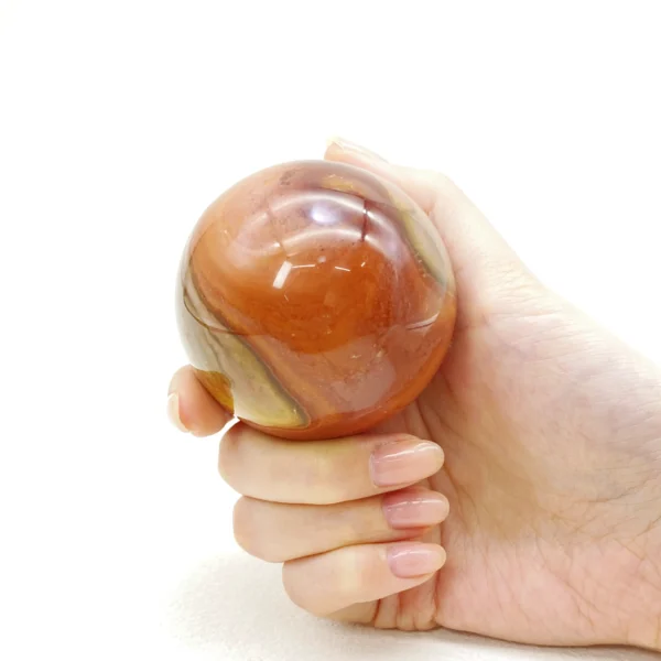 The Ocean Jasper Sphere radiates soothing, rhythmic energy that supports emotional balance and gentle renewal. Its calming presence helps ease exhaustion and restore harmony when life feels overwhelming. Resting securely on its round base, it brings a sense of flow and wholeness to any space.