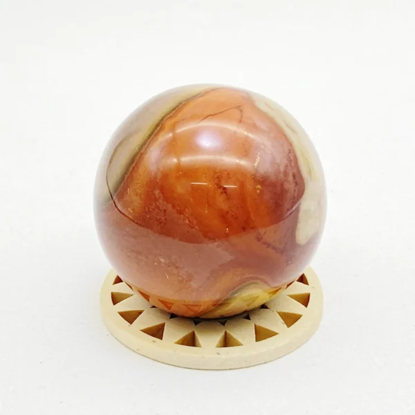 The Ocean Jasper Sphere radiates soothing, rhythmic energy that supports emotional balance and gentle renewal. Its calming presence helps ease exhaustion and restore harmony when life feels overwhelming. Resting securely on its round base, it brings a sense of flow and wholeness to any space.