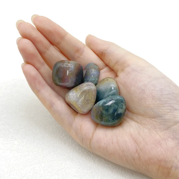 Flow back into balance with the Ocean Jasper Tumbled Stone, a gentle companion that soothes emotions and restores inner harmony. Its rhythmic energy encourages acceptance and emotional renewal.