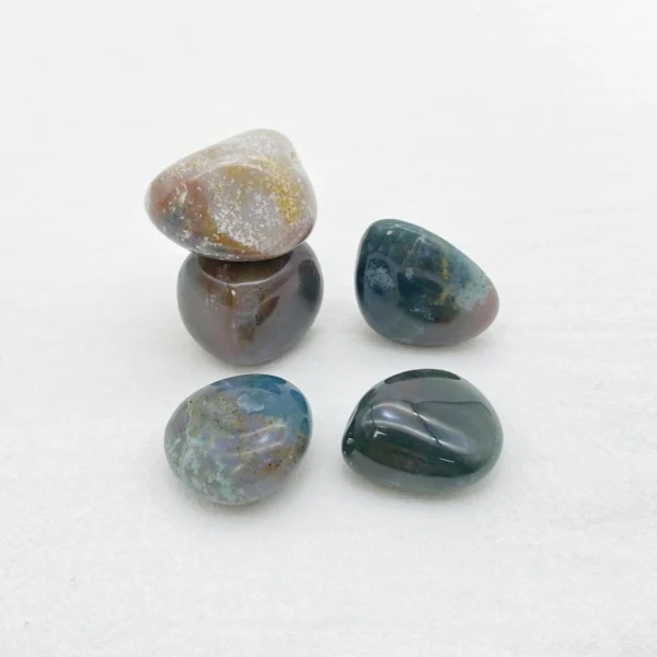 Flow back into balance with the Ocean Jasper Tumbled Stone, a gentle companion that soothes emotions and restores inner harmony. Its rhythmic energy encourages acceptance and emotional renewal.