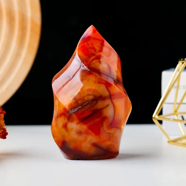 The Red Agate Flame is a grounding flame-shaped crystal that nurtures physical vitality while calming overstimulated energy. Gently supportive and stabilizing, it helps soothe tension, balance the body’s rhythms, and restore a sense of inner safety.