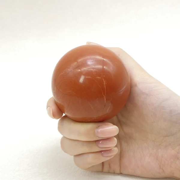 The Red Jasper Sphere radiates grounding strength and steady vitality. Deeply connected to the earth, it supports physical renewal while restoring balance during times of exhaustion. Resting on its round base, it anchors energy and encourages resilience throughout the body.