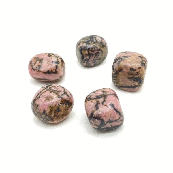 Heal and reconnect with the Rhodonite Tumbled Stone, a nurturing companion that supports emotional expression, heartfelt relationships, and inner growth. Its gentle energy encourages compassion and understanding.