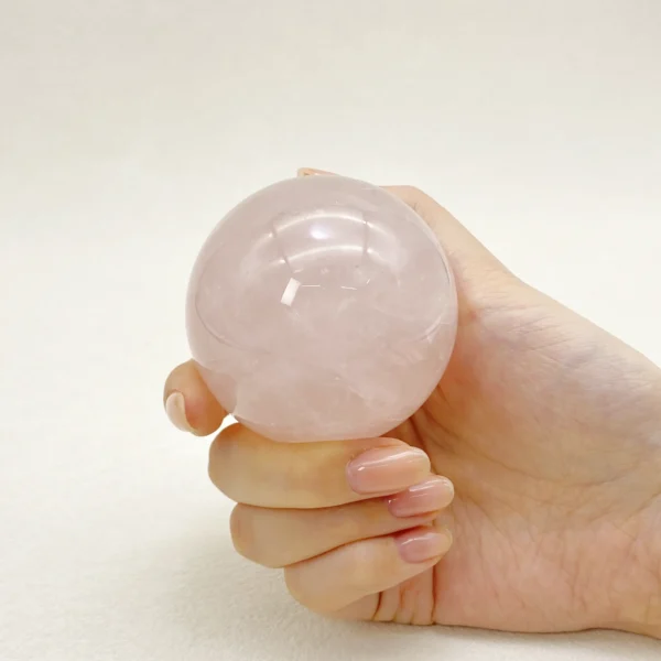 The Rose Quartz Sphere radiates gentle love, emotional comfort, and heart-centered harmony. Its soft, nurturing energy supports healing, forgiveness, and deeper connection with yourself and others. Resting on its round base, it brings warmth and compassion into any space.