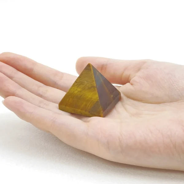 The Tigers Eye Pyramid channels courage, focus, and steady confidence into your space. Its grounding yet energizing presence supports decisive action, personal strength, and clear communication. Ideal for workspaces, study areas, or moments requiring self-assurance, it helps you face challenges with clarity and inner resolve.