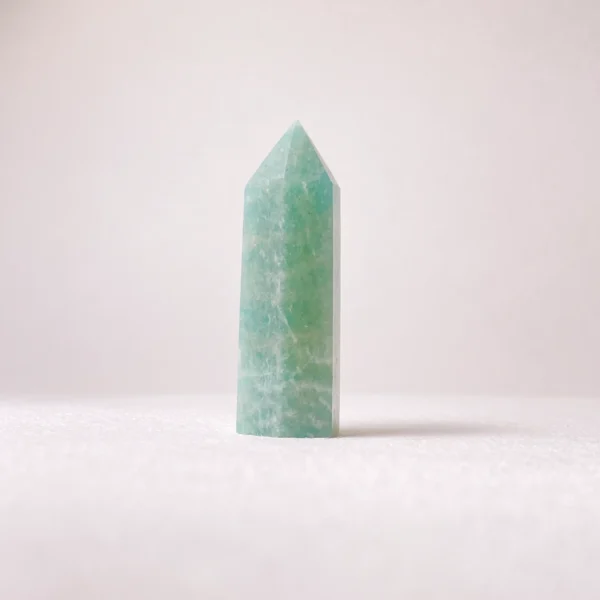 The Amazonite Mini Point is a stone of gentle truth and courageous transformation. Known for its calming blue-green tones, it supports heartfelt communication, emotional healing, and graceful change. Its pointed form helps direct soothing yet empowering energy, guiding you to express your truth clearly while embracing new beginnings with confidence and inner peace.